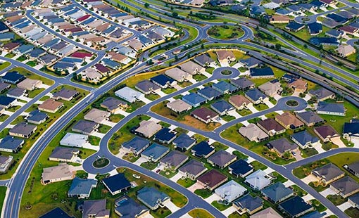 Aerial photo of a cluster of houses in Orlando, Florida. The roofs are shown, which NREL analysts assessed using the dGen model to determine if there is potential for solar rooftop PV adoption.