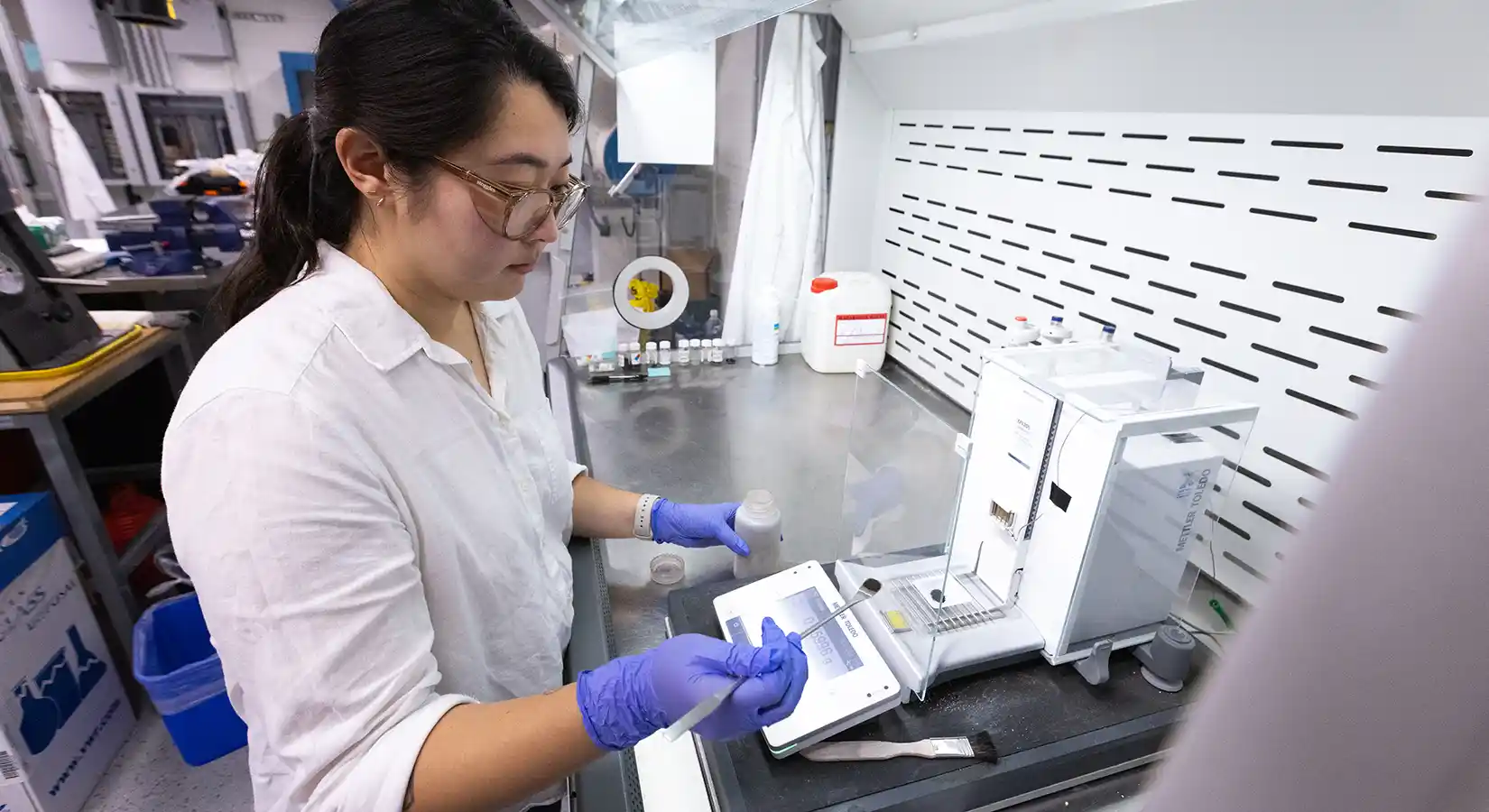 Researcher weighs a catalyst used to capture and convert CO2 in the Fuel Synthesis Catalysis Laboratory.