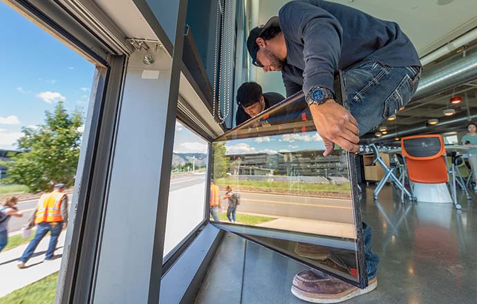 Men installing a window.