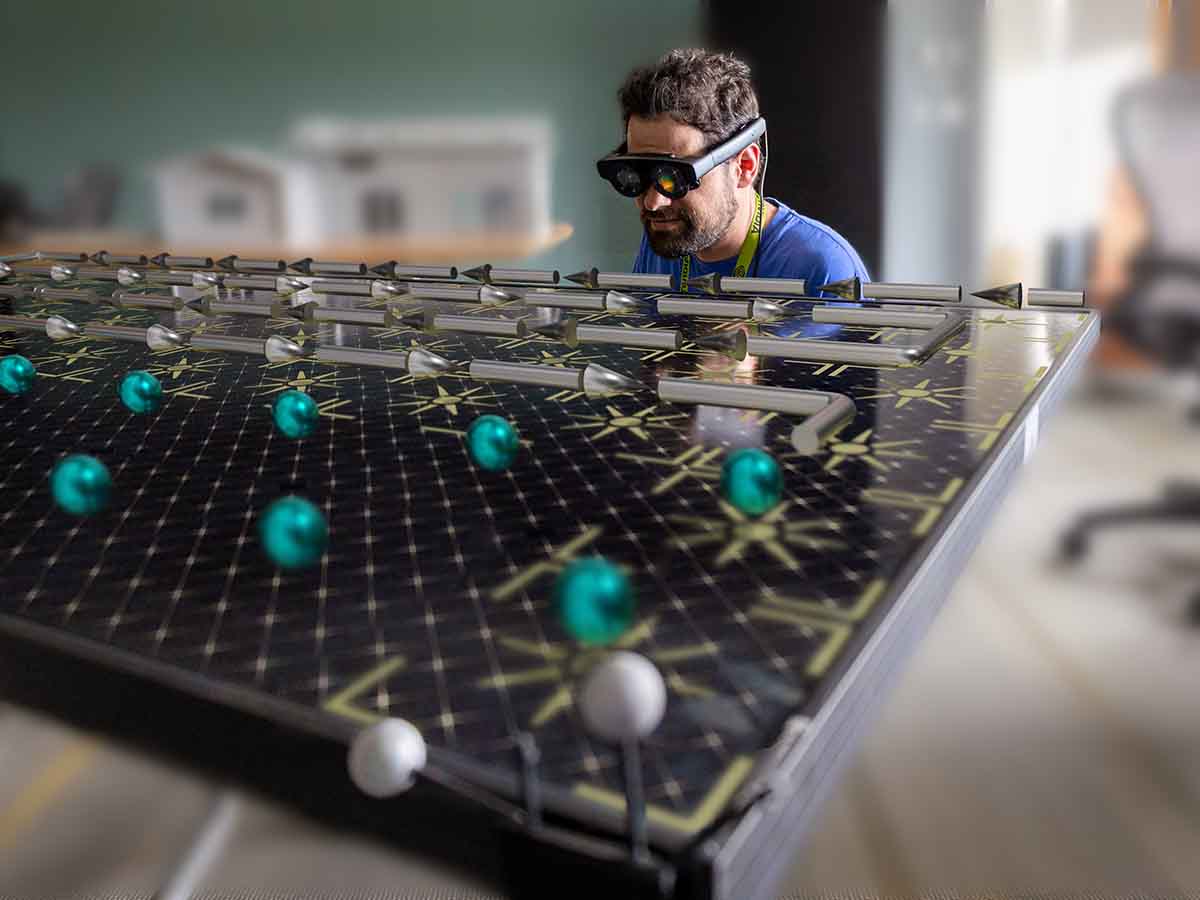 Two researchers standing in front of a wall-size, 3D visualization.