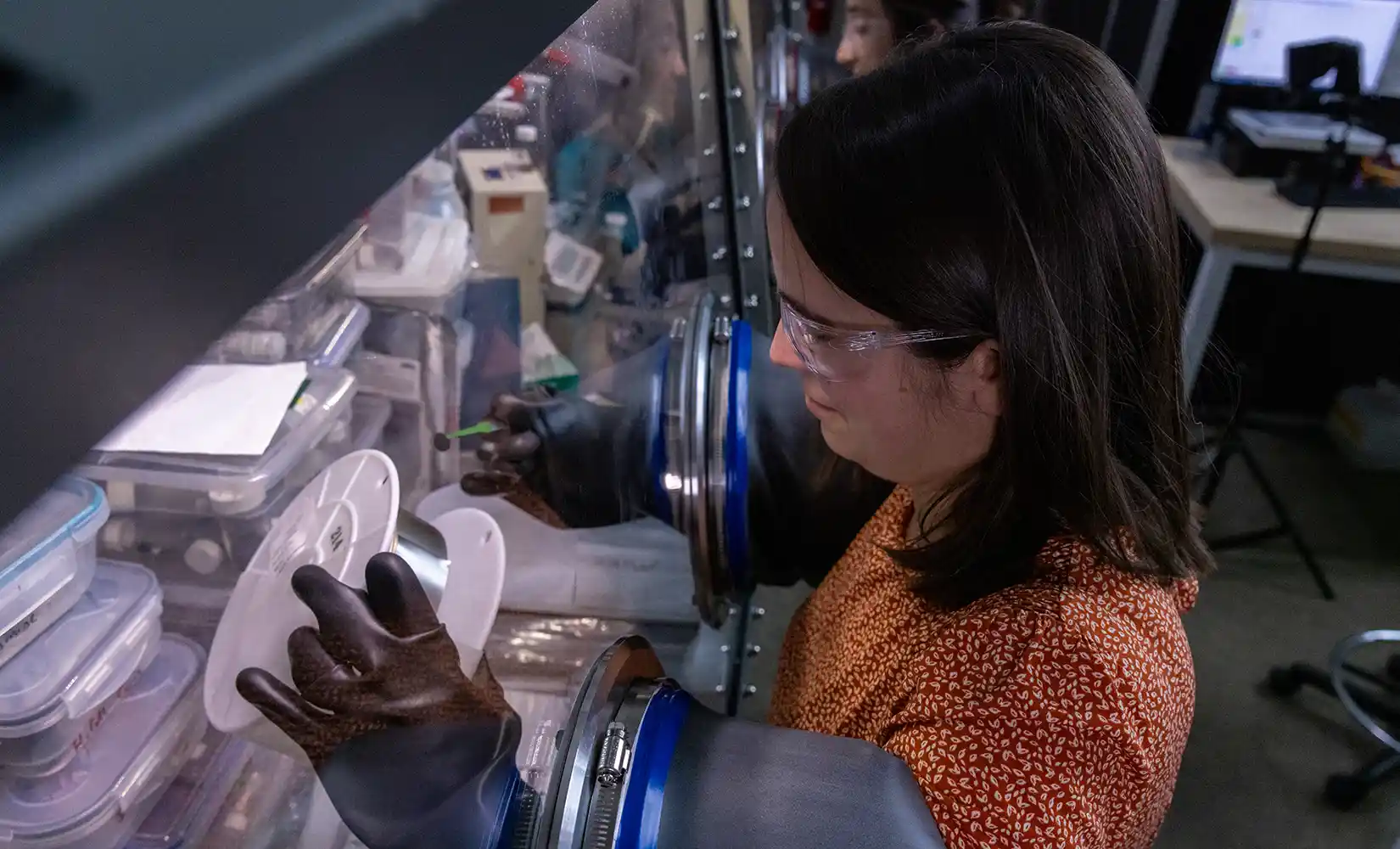 Researcher works in a glovebox.