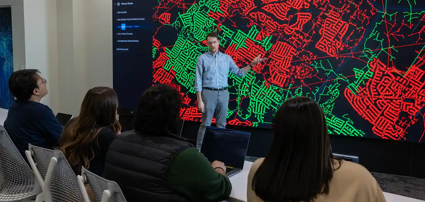 097305-hero Researcher presents cybersecurity grid data to group of people