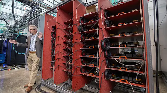 Researcher gives tour of ESIF facility to discuss cyber engineering