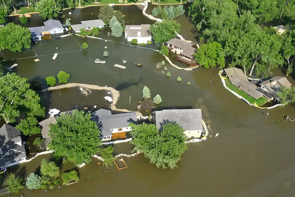 An aerial photo of floodwaters inundating homes in Iowa.