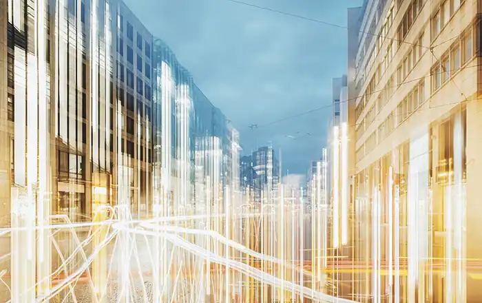 Modern creative zoom rush hour night street scene with traffic lights.