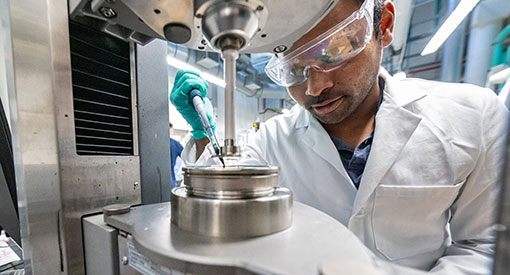 Person processing ink in a laboratory