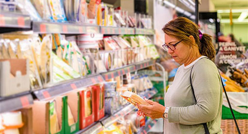 Person looking at groceries in supermarket