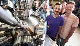Five people work in a laboratory on geothermal technology