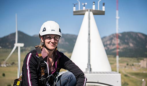 Engineer atop a wind turbine.