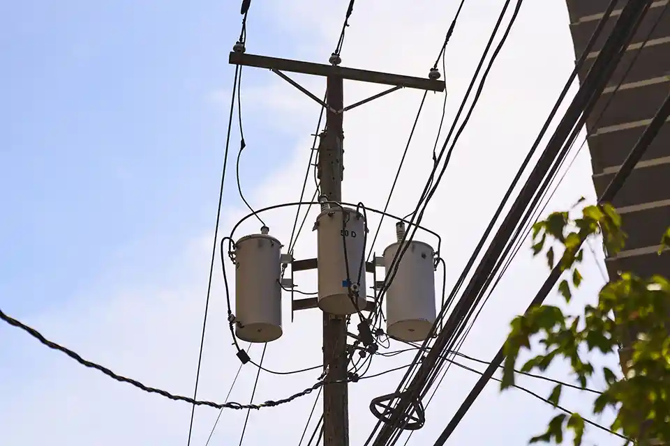 getty-2182546654-flt Grid transmission box on a power pole.
