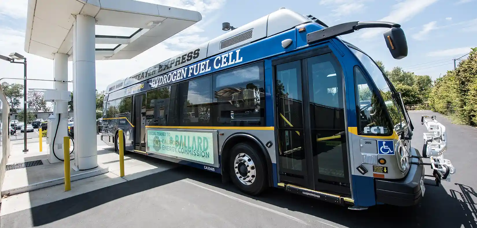 A hydrogen fuel cell bus at a hydrogen fueling station