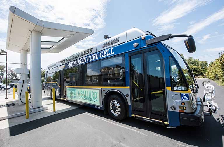 A hydrogen fuel cell bus at a hydrogen fueling station.