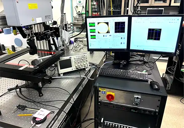 Durham MagnetoOptics NanoMOKE3 Wafer Mapper connected to a computer with two monitors
