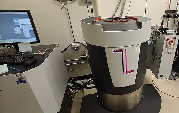 Quantum Design Physical Properties Measurement System connected to a computer with a monitor