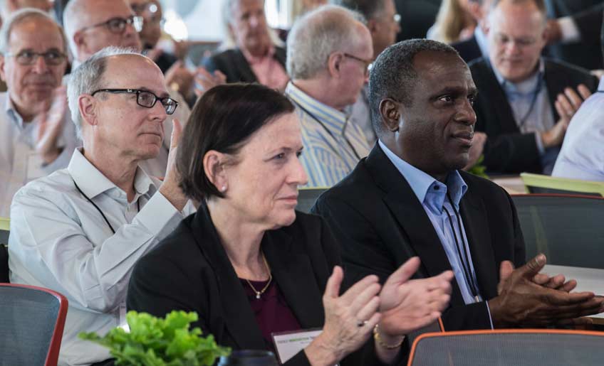 Photo of an audience applauding.