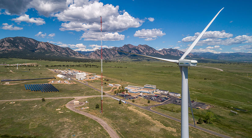 Aerial photo of NREL's Flatirons Campus with mountains in background