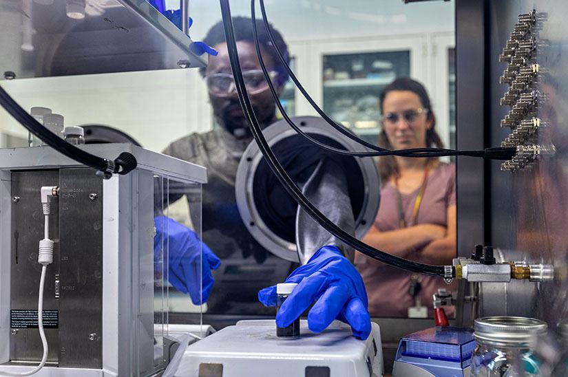 Two people work in a laboratory.