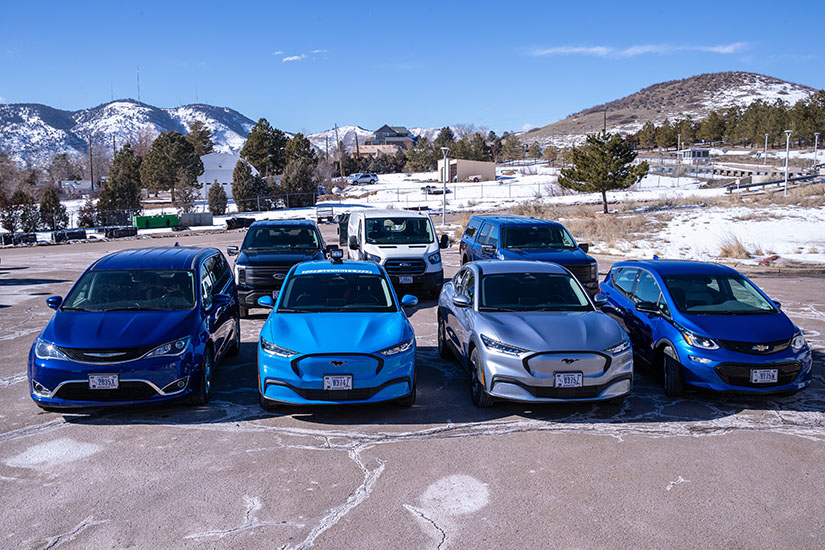 A group of electric vehicles parked facing the camera.