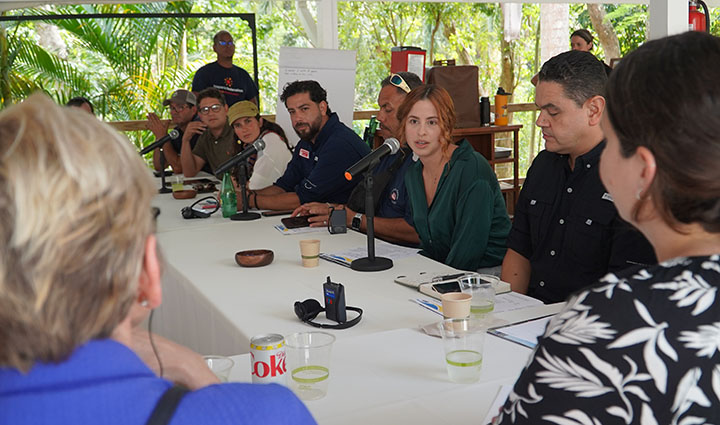 A  group of people sitting at a table during an interview.