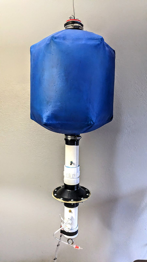 A pressurized bag attached to piping.