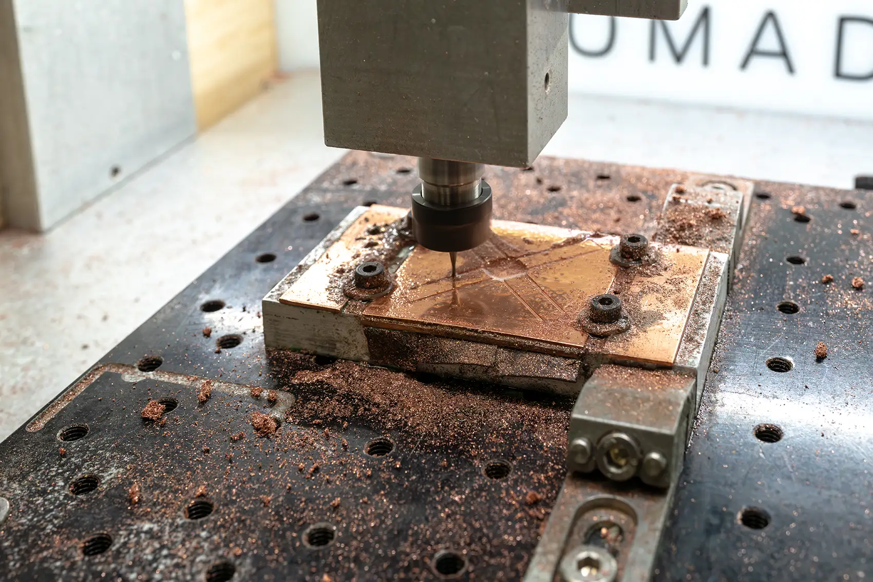 Copper components are machined using a high-precision laser cutter.