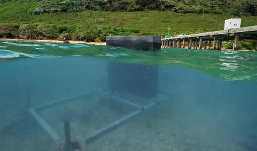 Continue reading about The National Laboratory of the Rockies' SURF-WEC device deployed off the Makai Pier in Oahu.