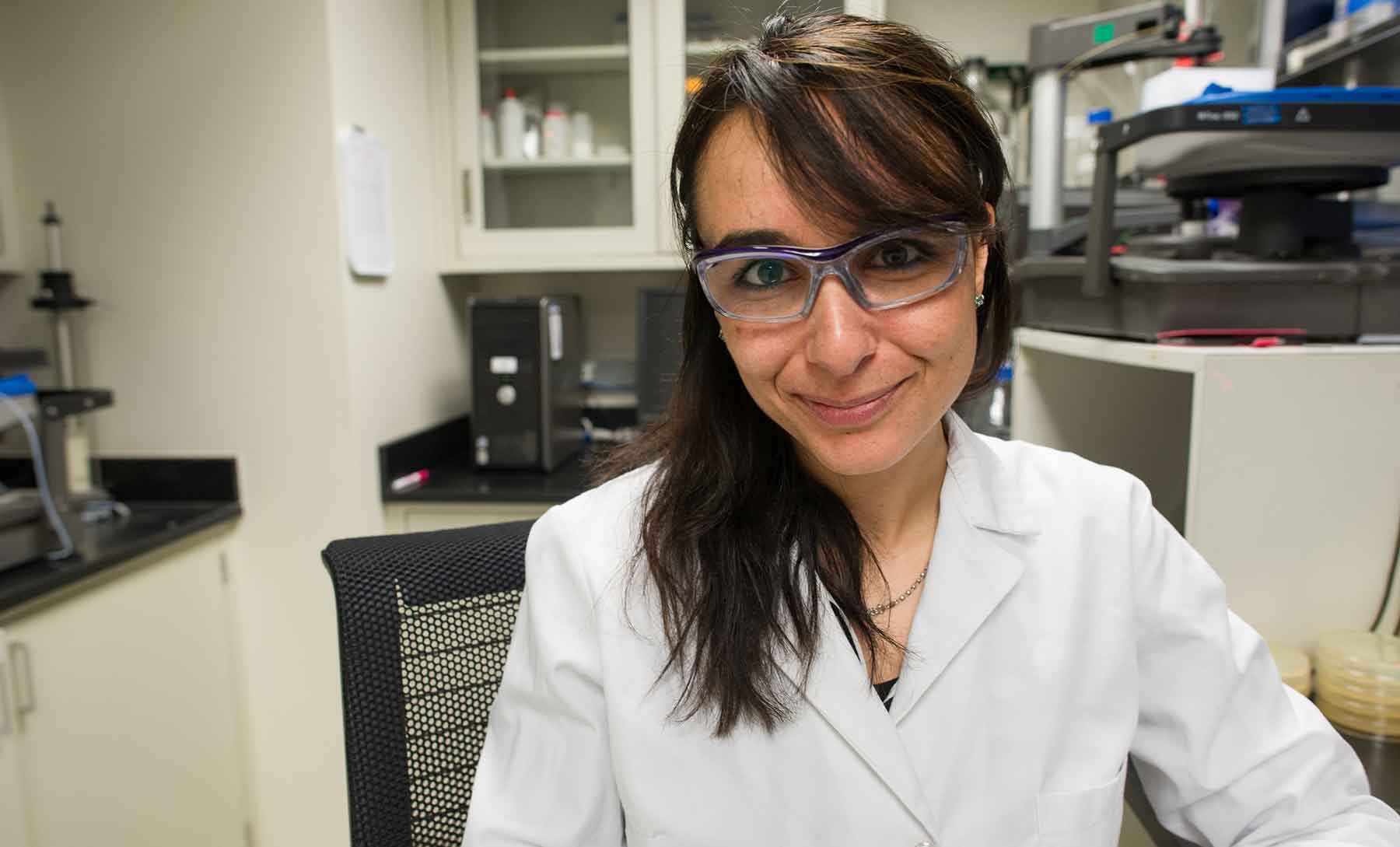 A woman works in a laboratory.