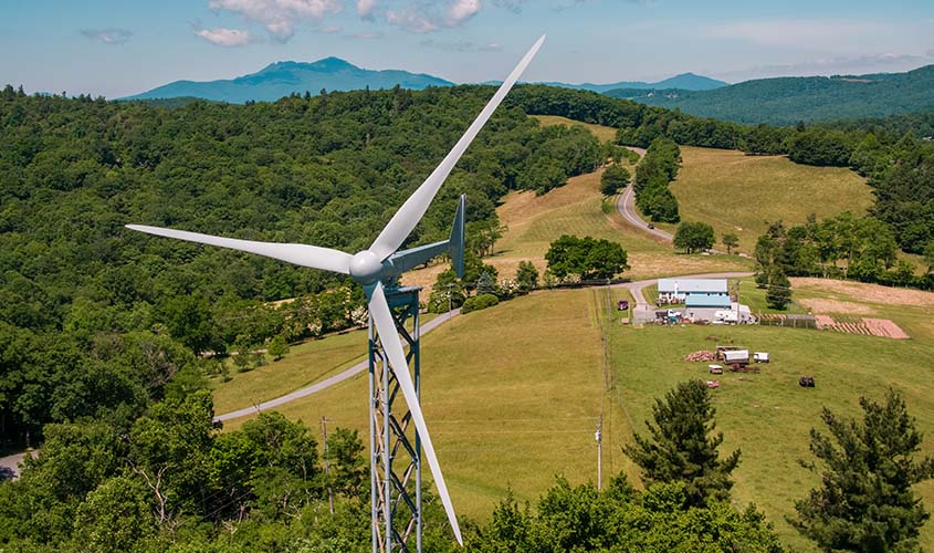 A small wind turbine in a rural setting.