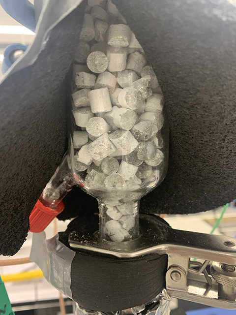 Photo shows cylinders of strontium chloride cement in a laboratory-scale reactor.