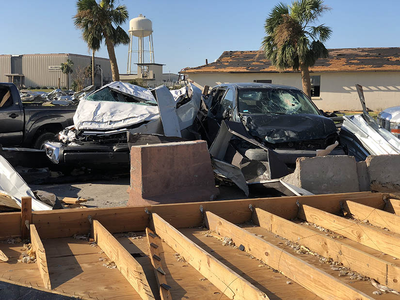 Parked vehicles damaged after a hurricane strike