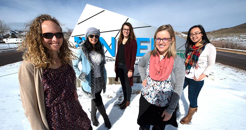 Photo of Kate Anderson with the women of the REopt energy optimization modeling team.