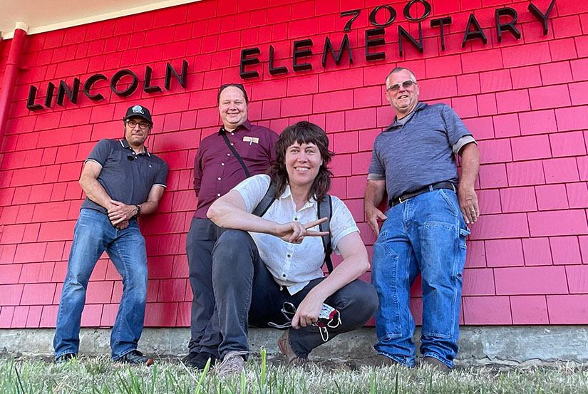 A group of people standing outside a building.