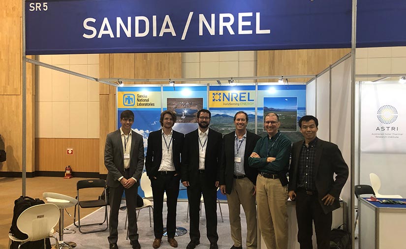 A group of men smiling.