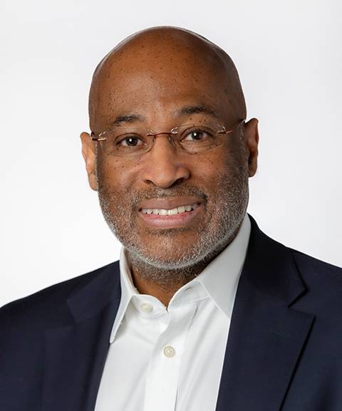 Portrait of a man smiling.