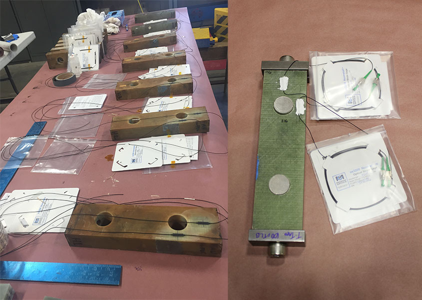 A table covered in rectangular components with paper labels attached and a close-up of one of them.