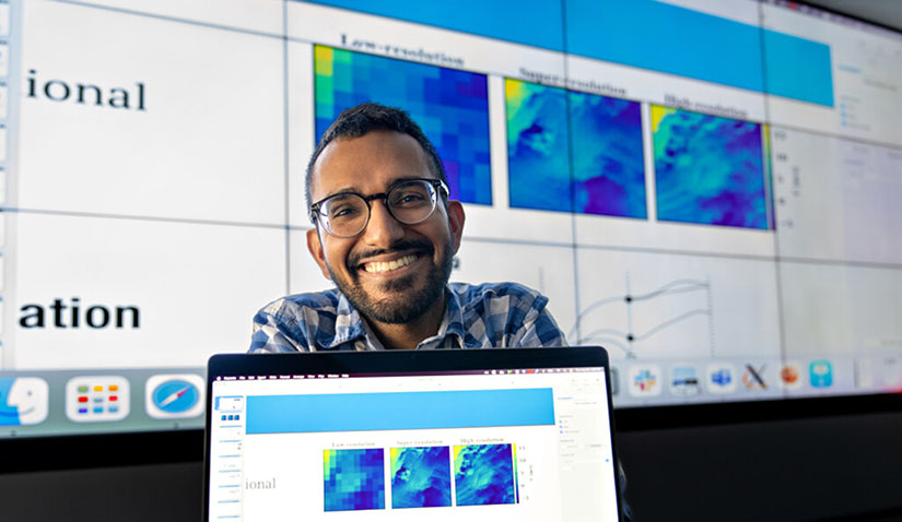 Man with laptop computer in front of him