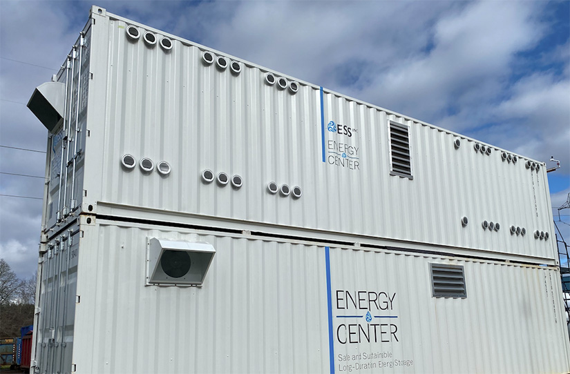 Two white storage containers, stacked on top of the other.