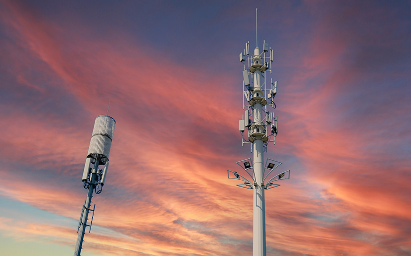 Telecommunication towers at sunset. 