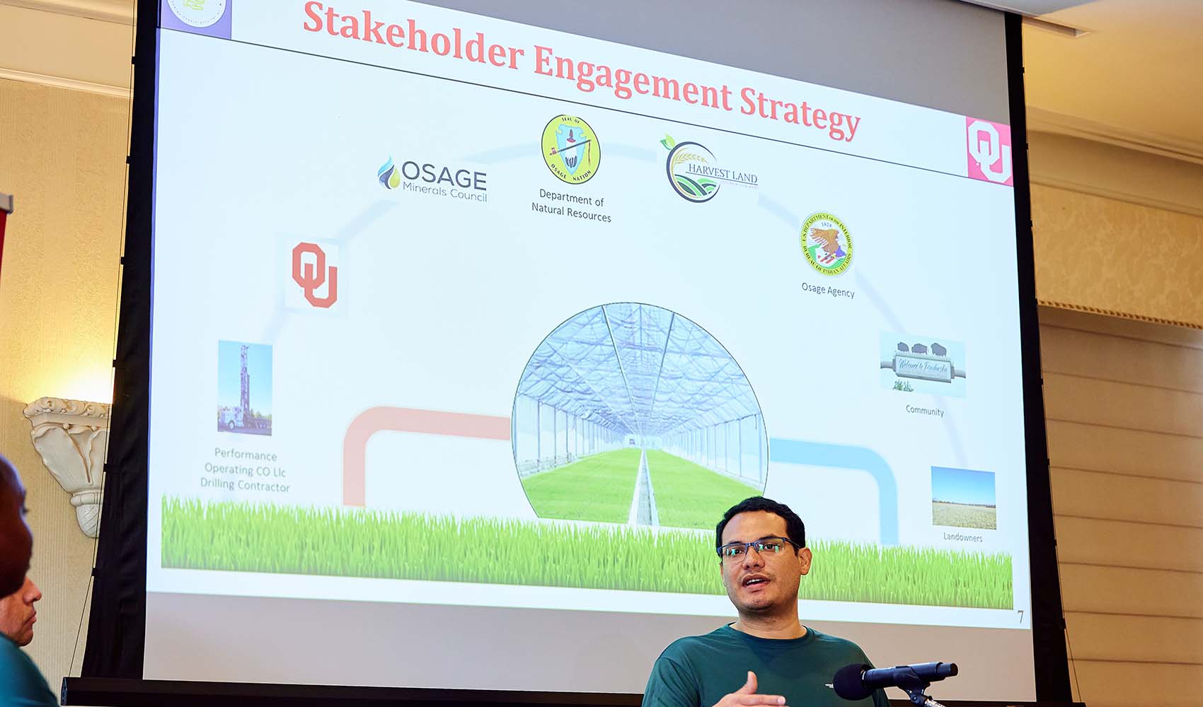 An individual speaks at a podium.