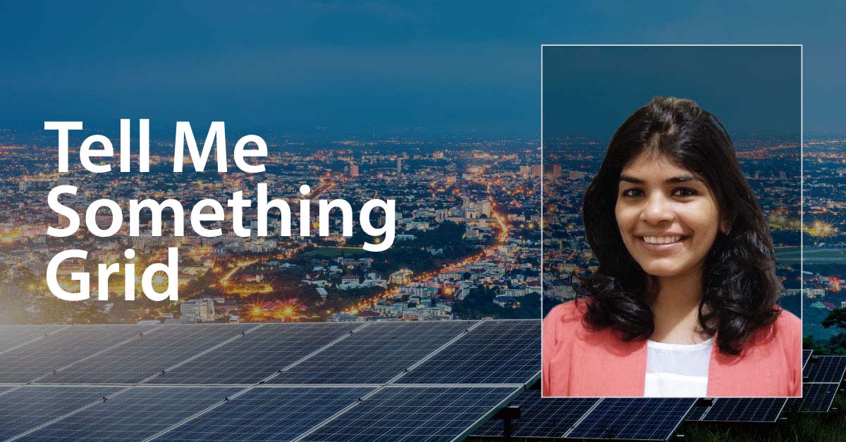 Solar panels in the forefront of city lights overlain by the words 