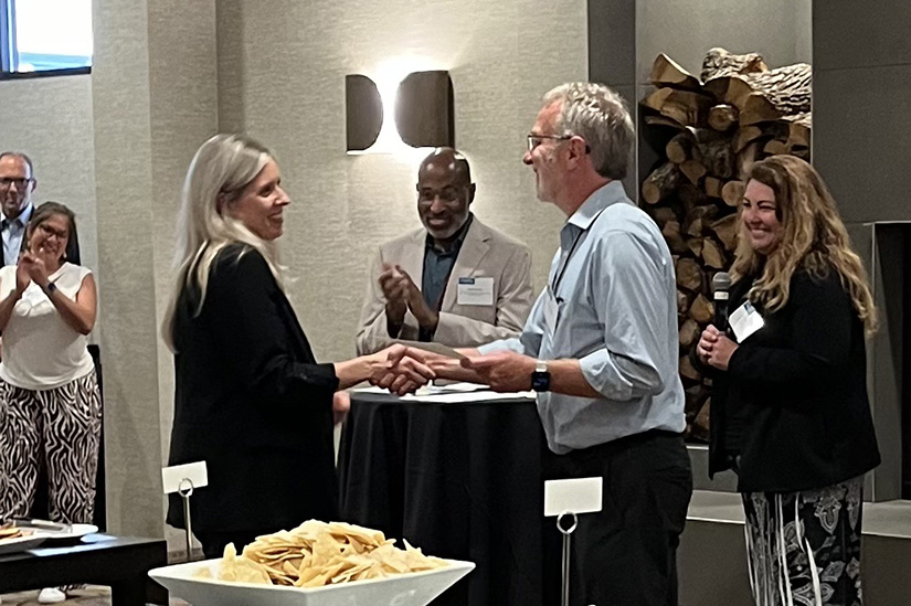 Two people shaking hands. 