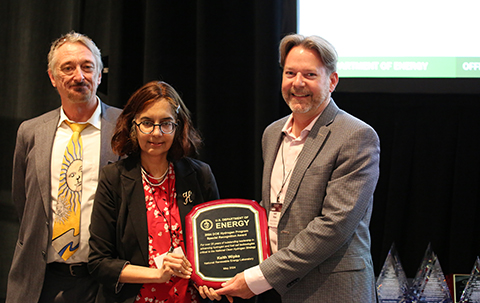 Eric Miller and Sunita Satyapal present an award plaque to Keith Wipke.