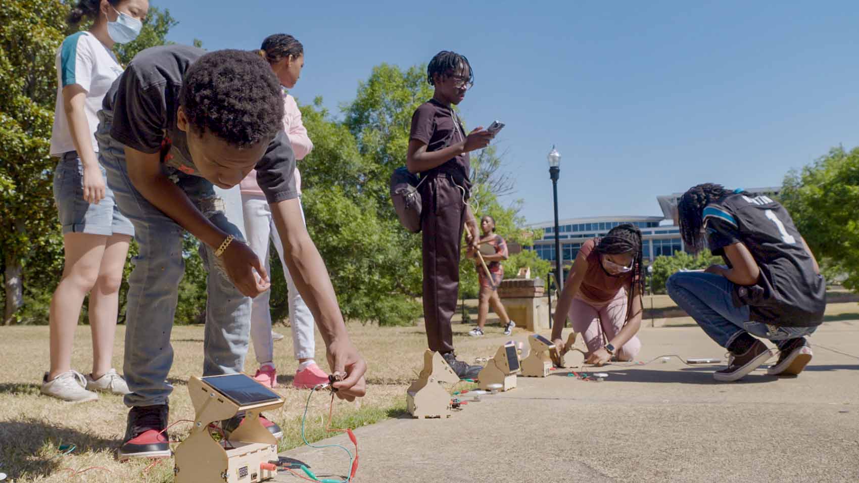 Students work on outdoor solar energy experiments