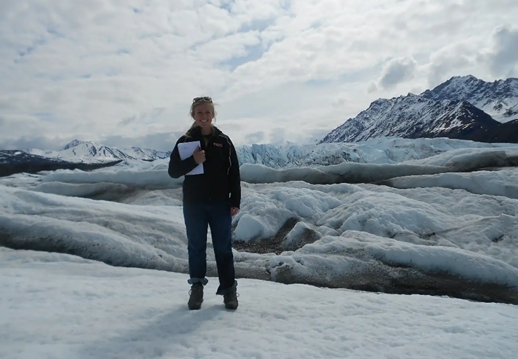 Alli Werner standing on a glacier