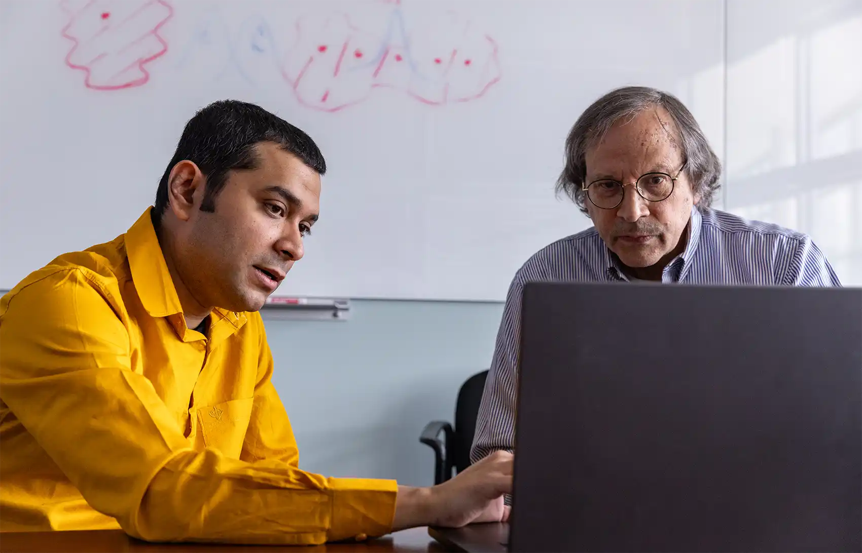 NREL researchers Swagata Acharya and Mark van Schilfgaarde discuss their research on exciton formation.