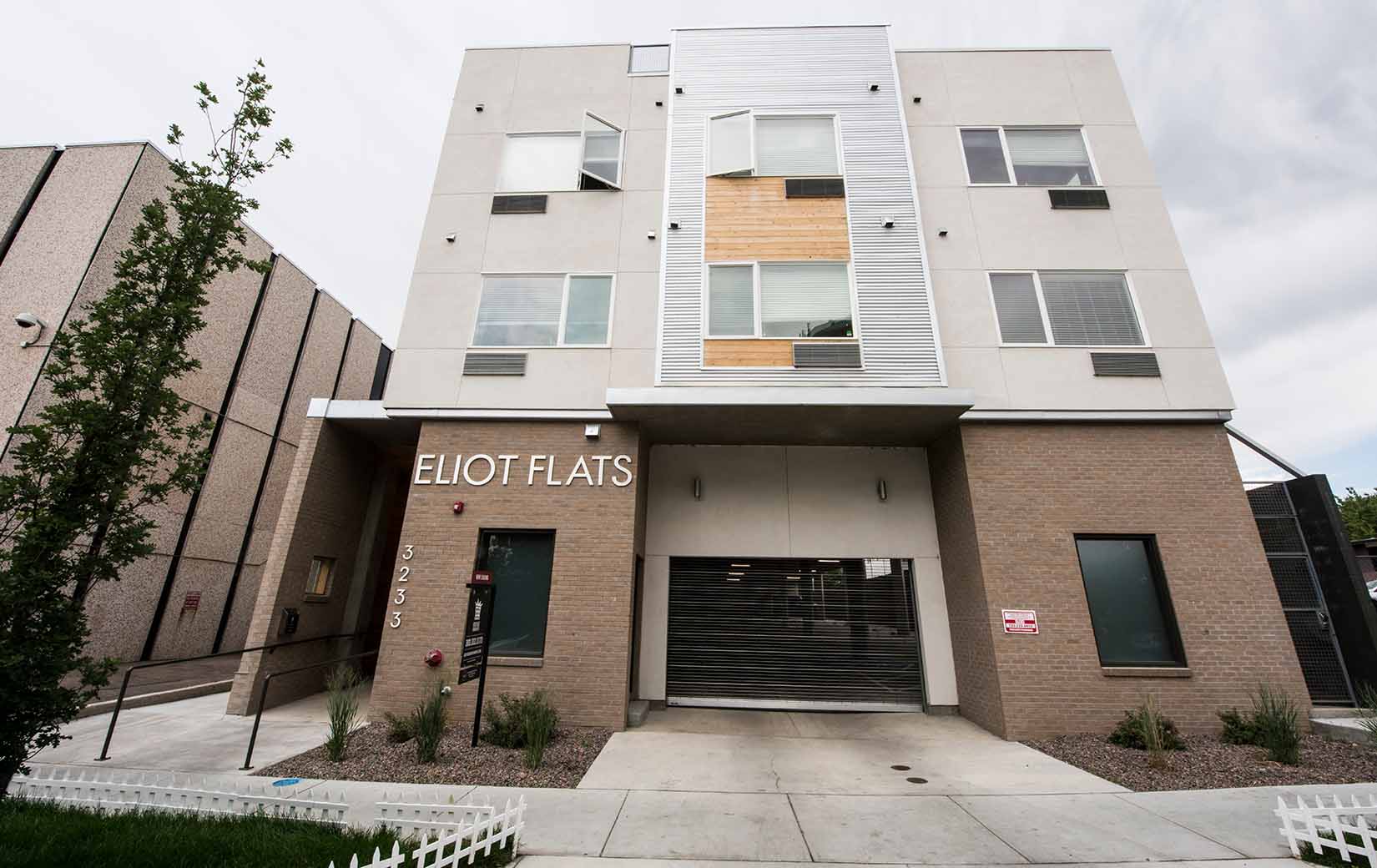 An exterior photo of the Eliot Flats apartment building