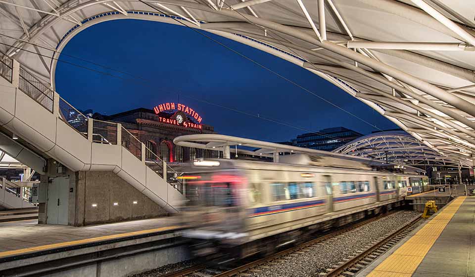 A train moving through a train platform at Denver's Union Station.