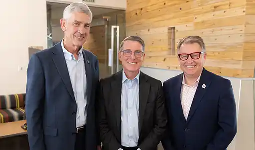 Continue reading about Three people smiling.
