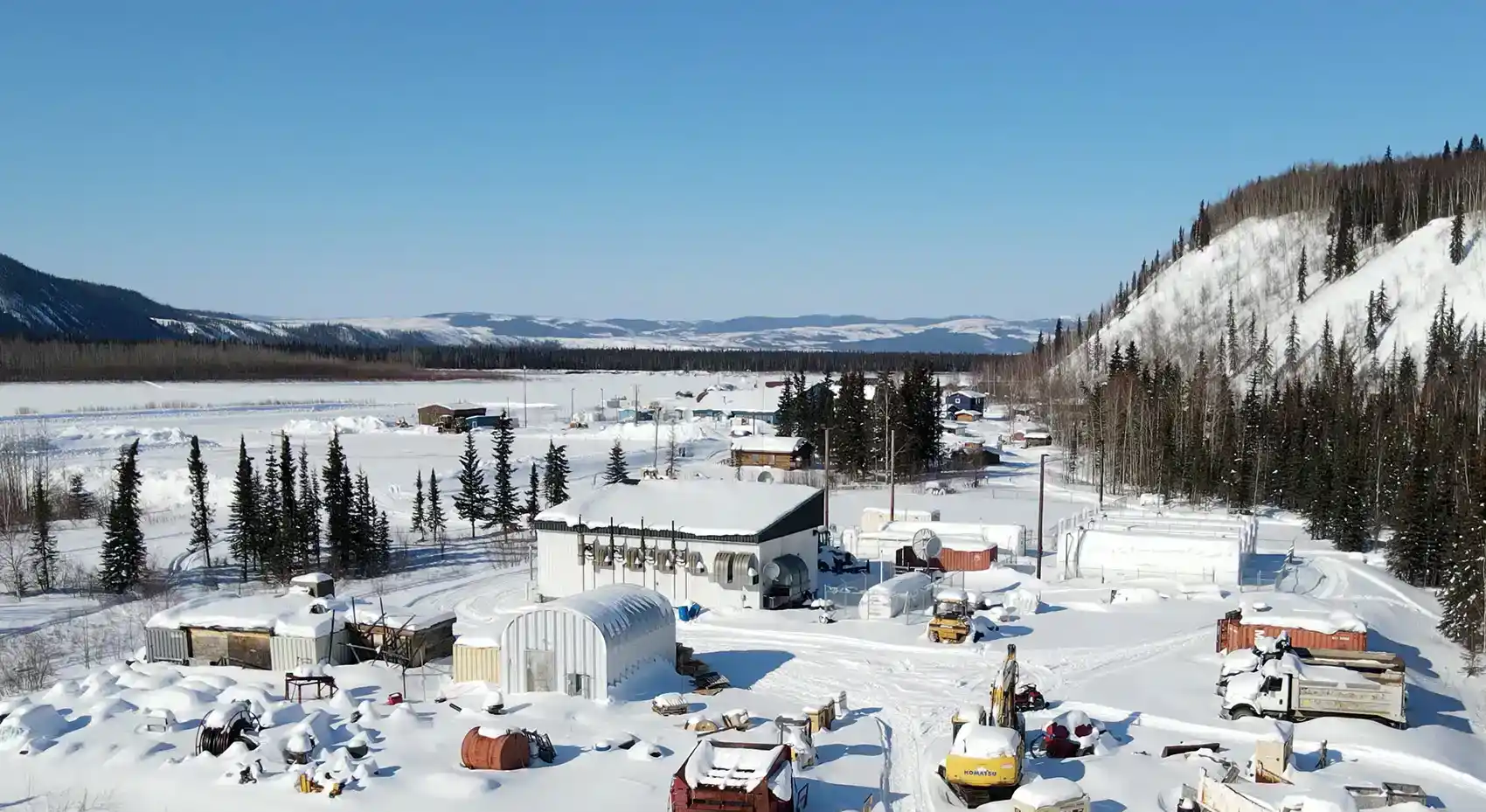 20260513-new-doe-funding-opportunity-to-strengthen-microgrids-in-remote-and-industrial-regions-hughes-alaska An aerial image of Hughes, Alaska, in the snow.