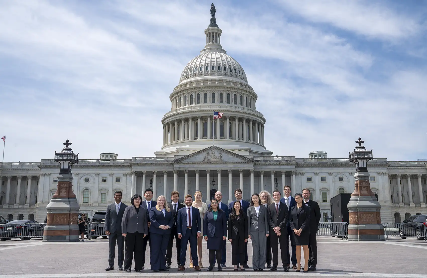 20260526-nlr-kalen-rasmussen-wins-energy-security-award-at-national-lab-research-slam-9677 A group of people stand in front of the United States Capitol